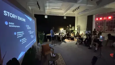 Tim Ramak beside the projected story engine slide as attendees follow the Filmmaking 101 lesson.