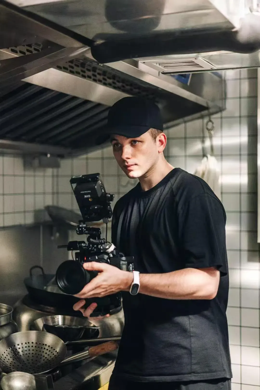 Vlad filming with a cinema camera in a professional kitchen